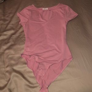 A pink bodysuit